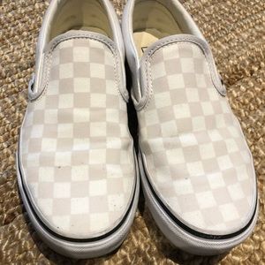 White checkered Vans slip on